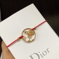 Bransoletka Christian Dior Diorelita z żółtego złota z wzorem hortensji i czerwonego sznurka bawełnianego