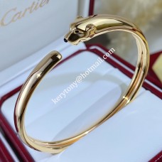 Bransoletka Retro Panthere de Cartier z onyksu i granatów tsavorytowych, żółte złoto/różowe złoto/białe złoto